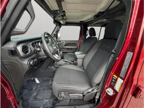 Photos of 2022 Jeep Wrangler Unlimited Sahara Sport Utility 4D for sale in Jacksonville, FL at Merit Auto Group Atlantic
