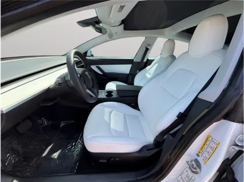Photos of 2021 Tesla Model 3 Standard Range Plus Sedan 4D for sale in Jacksonville, FL at Merit Auto Group Atlantic