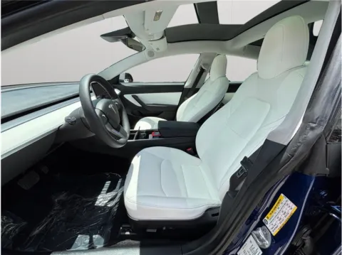 Photos of 2020 Tesla Model 3 Standard Range Plus Sedan 4D for sale in Jacksonville, FL at Merit Auto Group Atlantic