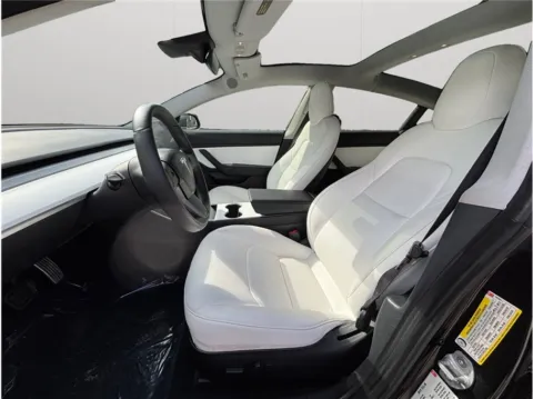 Photos of 2018 Tesla Model 3 Mid Range Sedan 4D for sale in Jacksonville, FL at Merit Auto Group Atlantic