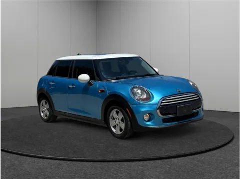 Blue 2015 MINI Hardtop 4 Door Cooper Hatchback 4D for sale in Jacksonville, FL