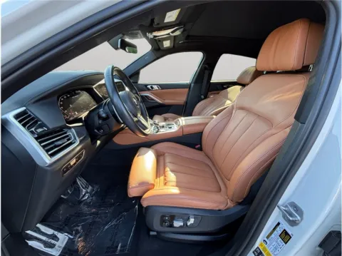 Photos of 2021 BMW X6 M50i Sport Utility 4D for sale in Jacksonville, FL at Merit Auto Group Atlantic