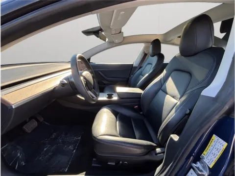 Photos of 2021 Tesla Model 3 Standard Range Plus Sedan 4D for sale in Jacksonville, FL at Merit Auto Group Atlantic