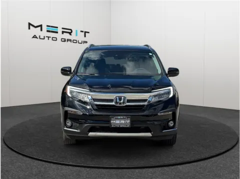 Another view of 2022 Honda Pilot Touring Sport Utility 4D for sale in Jacksonville, FL at Merit Auto Group Atlantic