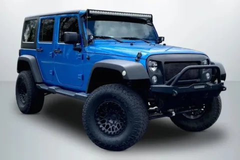 Photos of 2015 Jeep Wrangler Unlimited Sport SUV 4D for sale in Janesville, WI at Cool Car Guys