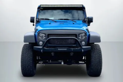 Another view of 2015 Jeep Wrangler Unlimited Sport SUV 4D for sale in Janesville, WI at Cool Car Guys