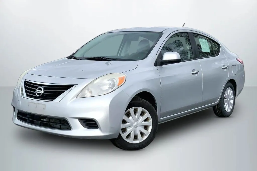Silver 2012 Nissan Versa SV Sedan 4D for sale in Janesville, WI