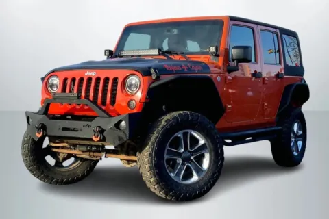 Orange 2015 Jeep Wrangler Unlimited Rubicon Sport Utility 4D for sale in Janesville, WI