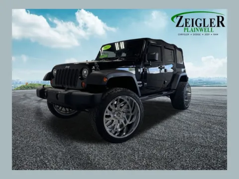 Black 2013 Jeep Wrangler Unlimited Sport for sale in Plainwell, MI