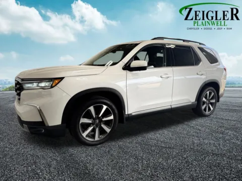 Photos of 2023 Honda Pilot Touring for sale in Plainwell, MI at Zeigler Chrysler Dodge Jeep Ram of Plainwell