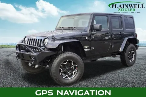 Black 2013 Jeep Wrangler Unlimited Sahara for sale in Plainwell, MI