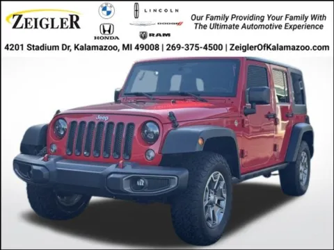 Red 2015 Jeep Wrangler Unlimited Sport for sale in Kalamazoo, MI