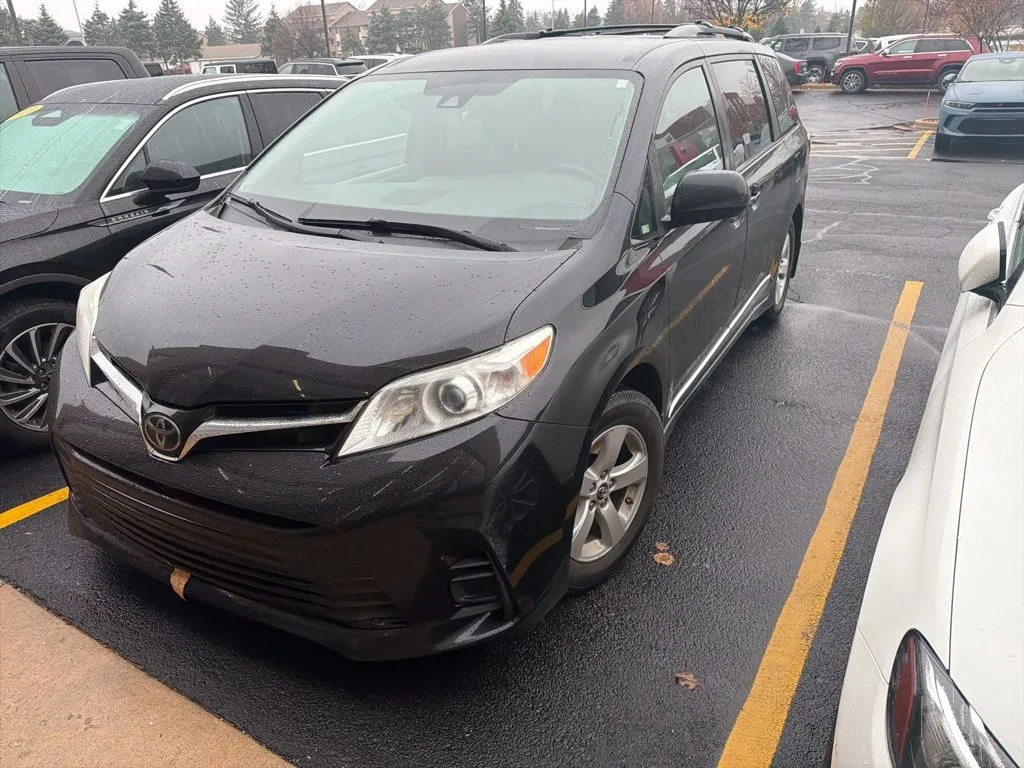 Black 2019 Toyota Sienna LE for sale in Grandville, MI