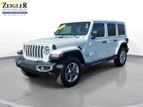 White 2023 Jeep Wrangler Sahara for sale in Grandville, MI