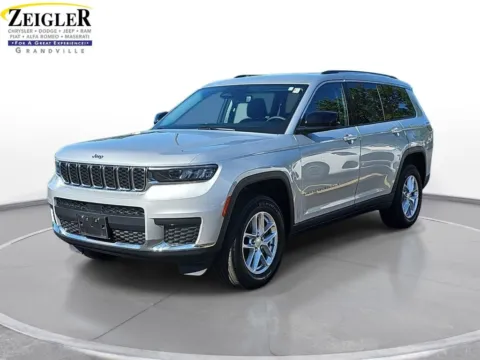 Silver 2023 Jeep Grand Cherokee L Laredo for sale in Grandville, MI