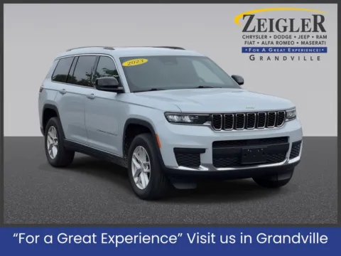 Silver 2023 Jeep Grand Cherokee L Laredo for sale in Grandville, MI