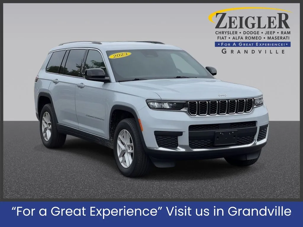 Silver 2023 Jeep Grand Cherokee L Laredo for sale in Grandville, MI