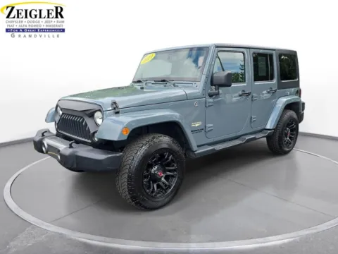 Gray 2014 Jeep Wrangler Unlimited Sahara for sale in Grandville, MI