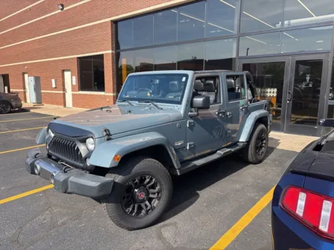 Gray 2014 Jeep Wrangler Unlimited Sahara for sale in Grandville, MI