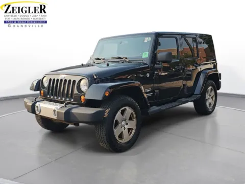 Black 2011 Jeep Wrangler Unlimited Sahara for sale in Grandville, MI