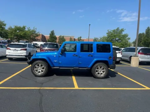 Silver 2016 Jeep Wrangler Unlimited Sahara for sale in Grandville, MI
