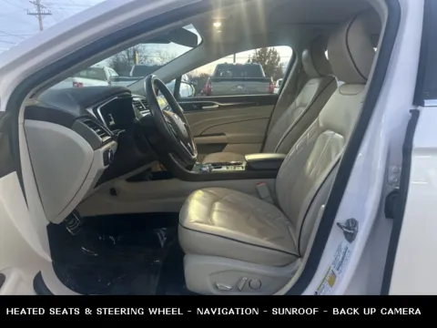 Photos of 2018 Ford Fusion Hybrid Platinum for sale in Lowell, MI at Zeigler Ford of Lowell