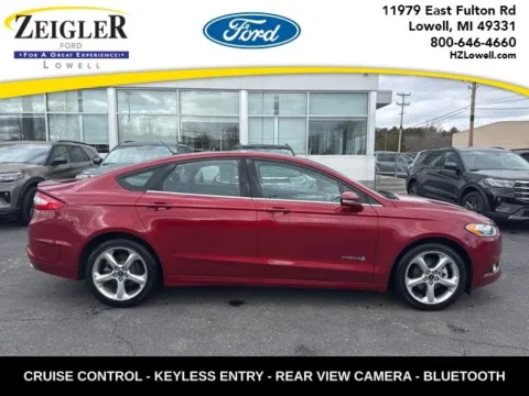 Red 2013 Ford Fusion Hybrid SE for sale in Lowell, MI