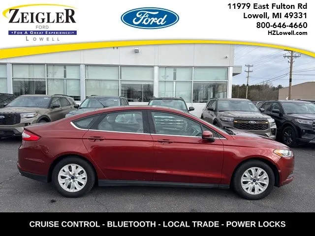 Orange 2014 Ford Fusion S for sale in Lowell, MI