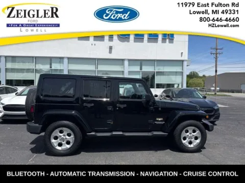 Black 2015 Jeep Wrangler Unlimited Sahara for sale in Lowell, MI