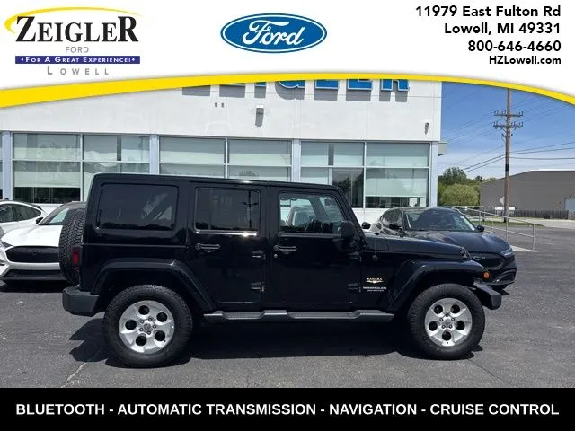 Black 2015 Jeep Wrangler Unlimited Sahara for sale in Lowell, MI