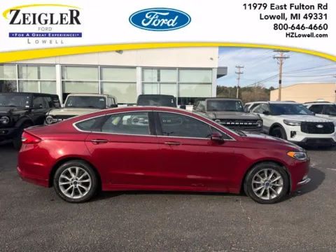 Red 2017 Ford Fusion SE for sale in Lowell, MI