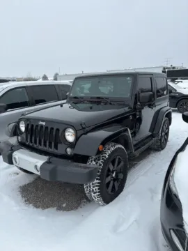 Black 2015 Jeep Wrangler Sahara for sale in Holland, MI