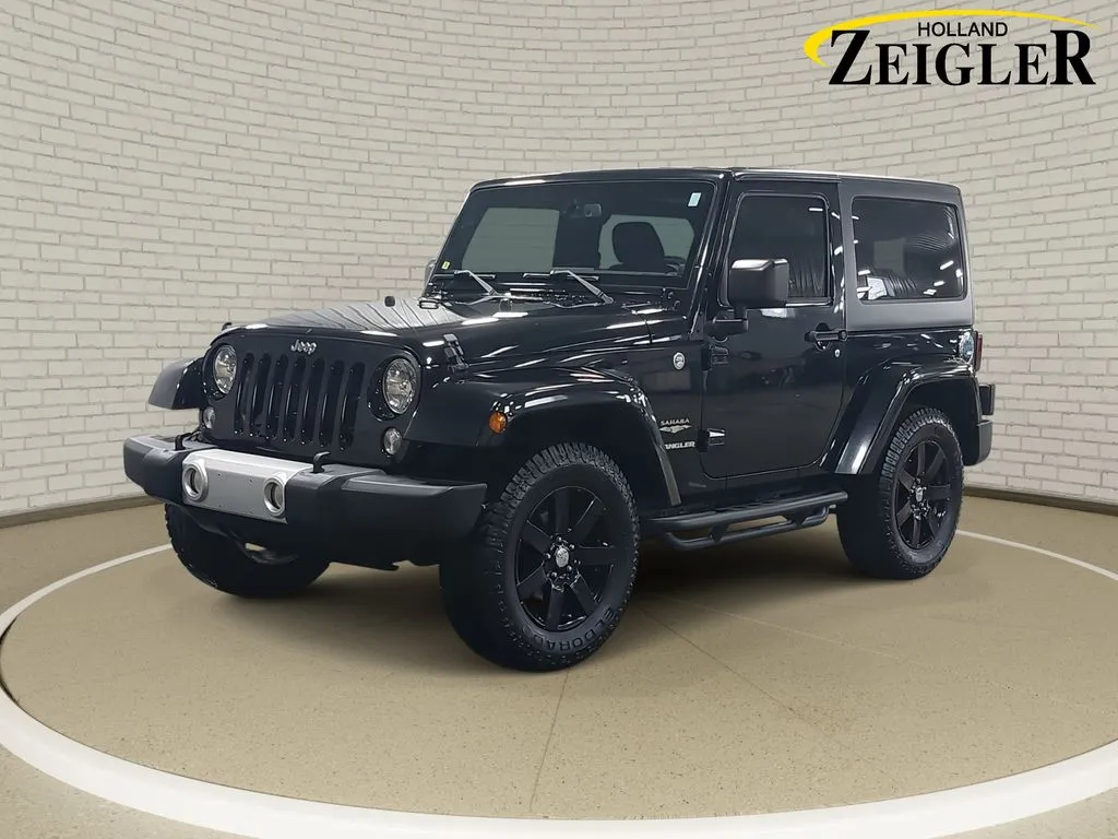 Black 2015 Jeep Wrangler Sahara for sale in Holland, MI