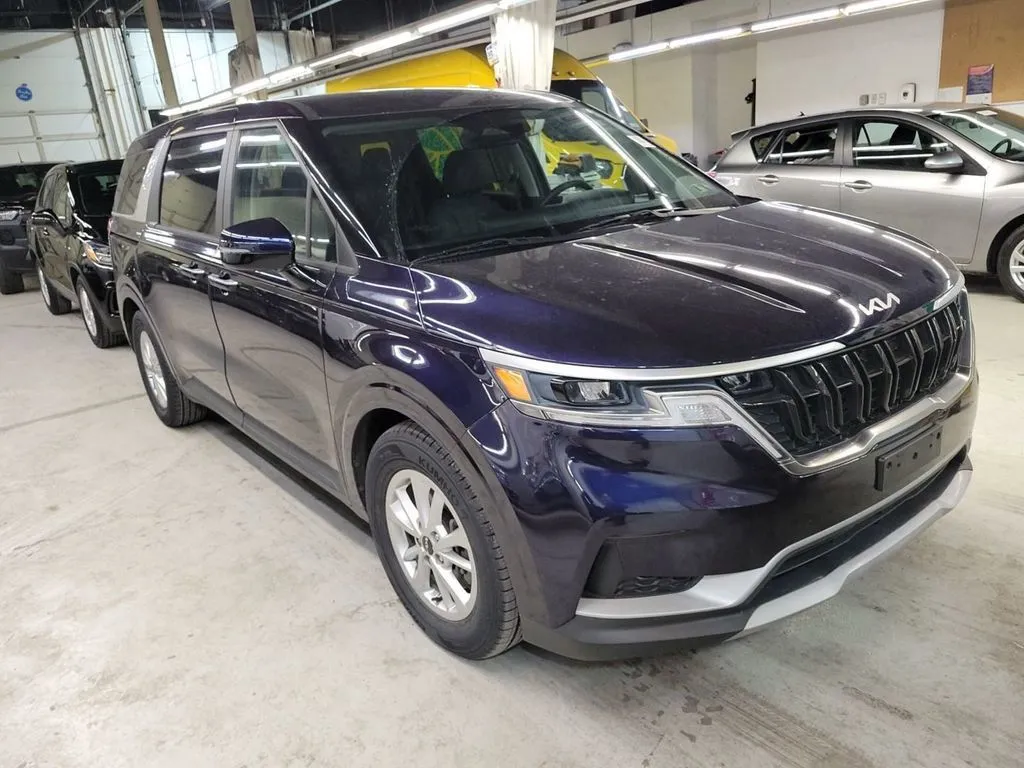 Blue 2023 Kia Carnival LX for sale in Holland, MI
