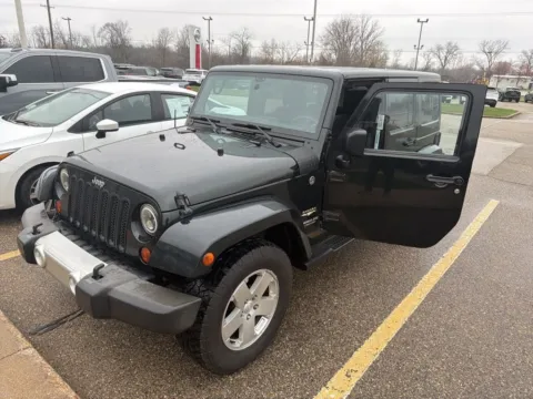 Black 2012 Jeep Wrangler Unlimited Sahara for sale in Holland, MI