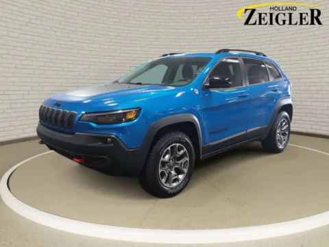 Blue 2023 Jeep Cherokee Trailhawk for sale in Holland, MI
