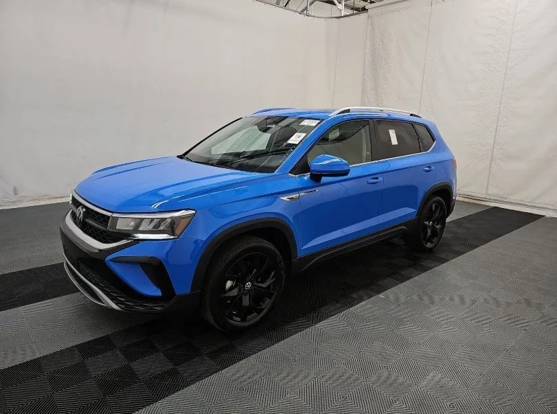 Blue 2023 Volkswagen Taos 1.5T SE for sale in Holland, MI