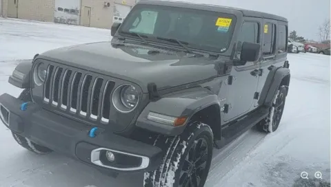 Gray 2023 Jeep Wrangler Sahara 4xe for sale in Holland, MI