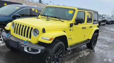Yellow 2023 Jeep Wrangler Sahara 4xe for sale in Holland, MI