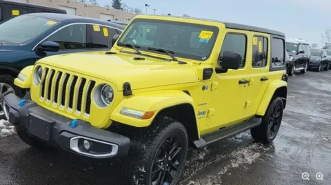 Yellow 2023 Jeep Wrangler Sahara 4xe for sale in Holland, MI