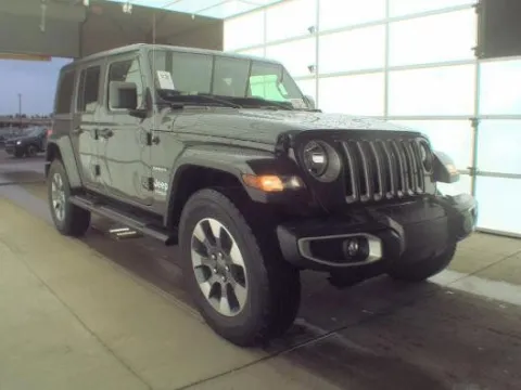 Gray 2022 Jeep Wrangler Unlimited Sahara for sale in Holland, MI