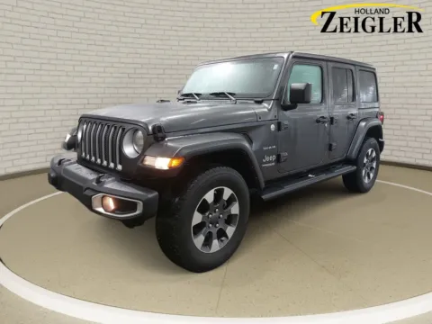 Gray 2022 Jeep Wrangler Unlimited Sahara for sale in Holland, MI