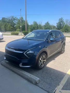 Blue 2023 Kia Sportage Hybrid EX for sale in Holland, MI