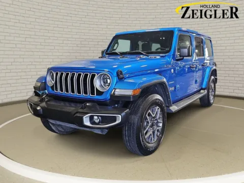 Blue 2024 Jeep Wrangler Sahara for sale in Holland, MI
