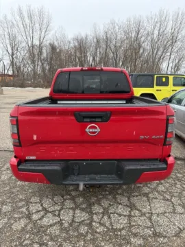 Red 2023 Nissan Frontier SV for sale in Holland, MI