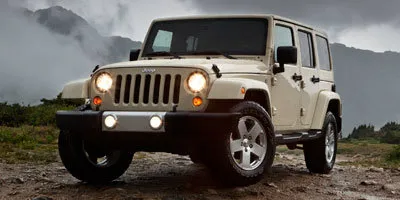 Orange 2012 Jeep Wrangler Unlimited Sport for sale in Redding, CA