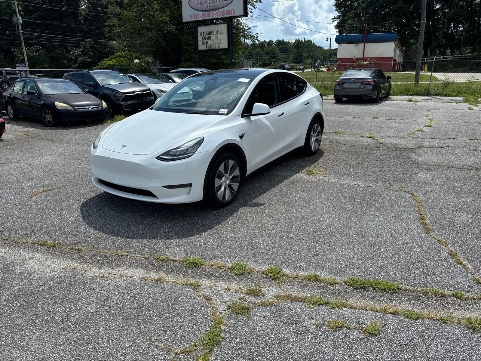 Used 2023 Tesla Model Y Long Range with VIN 7SAYGDEE0PA035238 for sale in Kennesaw, GA