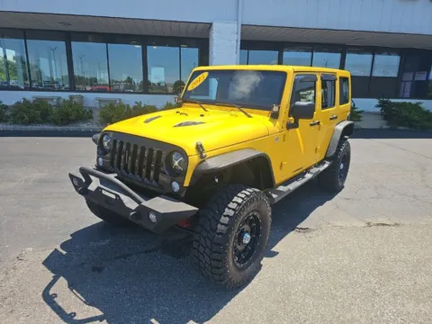 Yellow 2015 Jeep Wrangler Unlimited Sahara for sale in Muncie, IN