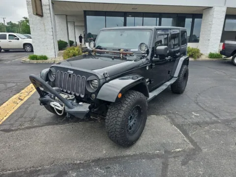 Black 2013 Jeep Wrangler Unlimited Sahara for sale in Muncie, IN