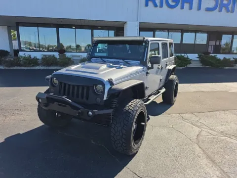 Silver 2014 Jeep Wrangler Unlimited Sahara for sale in Muncie, IN